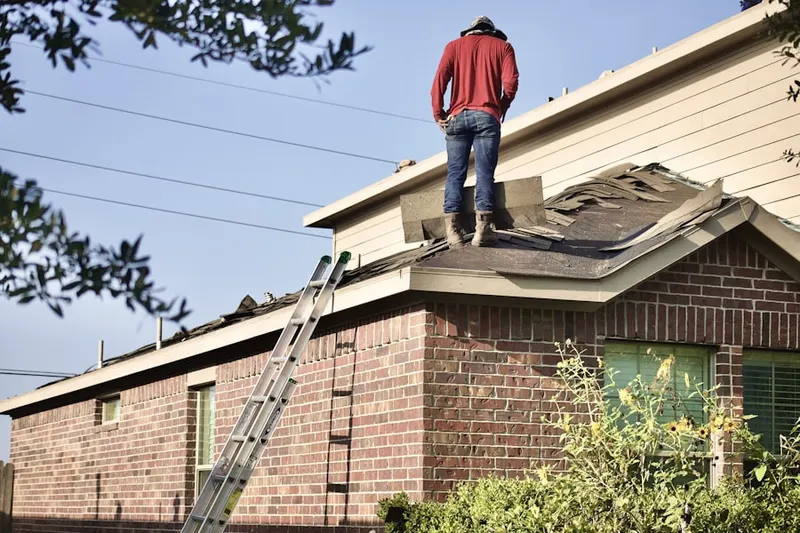 Professional roofer working on a residential roof in Monocacy Village